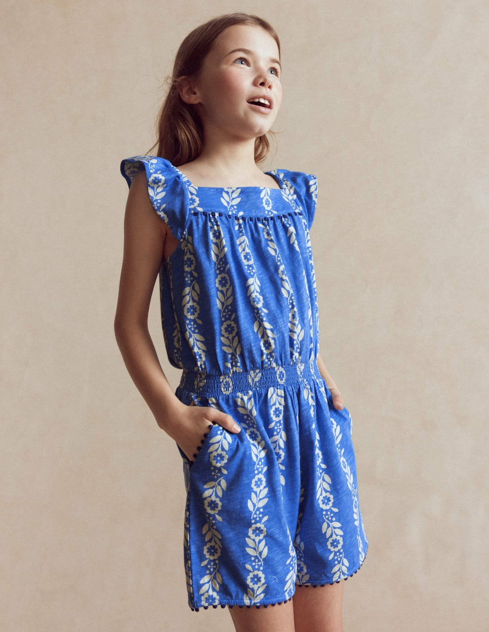 Ciara Pom Trim Jersey Romper-Blue Floral / Boden Sale